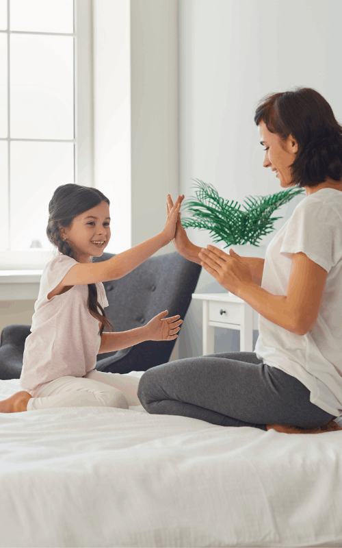 Mom and Daughter on Mattress Cleaned By Ecosuds in Stoney Creek Ontario