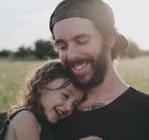 Happy Dad and young daughter outside